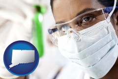 connecticut map icon and an environmental testing lab technician