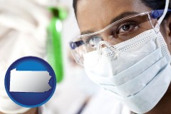 pennsylvania map icon and an environmental testing lab technician