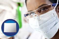 wyoming map icon and an environmental testing lab technician